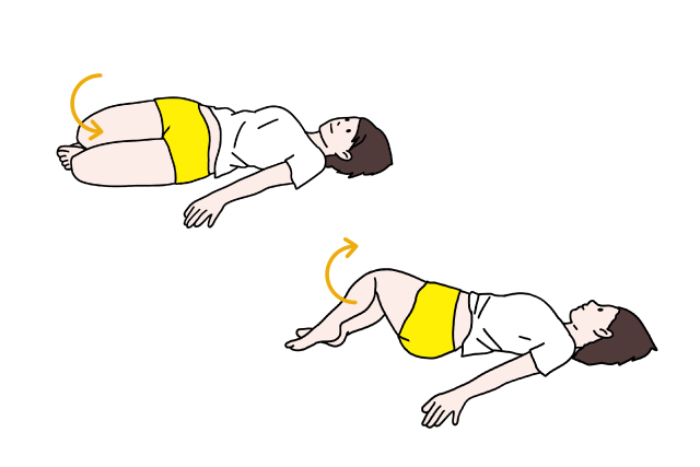 仰向けで膝を左右に倒すストレッチをする女性の画像